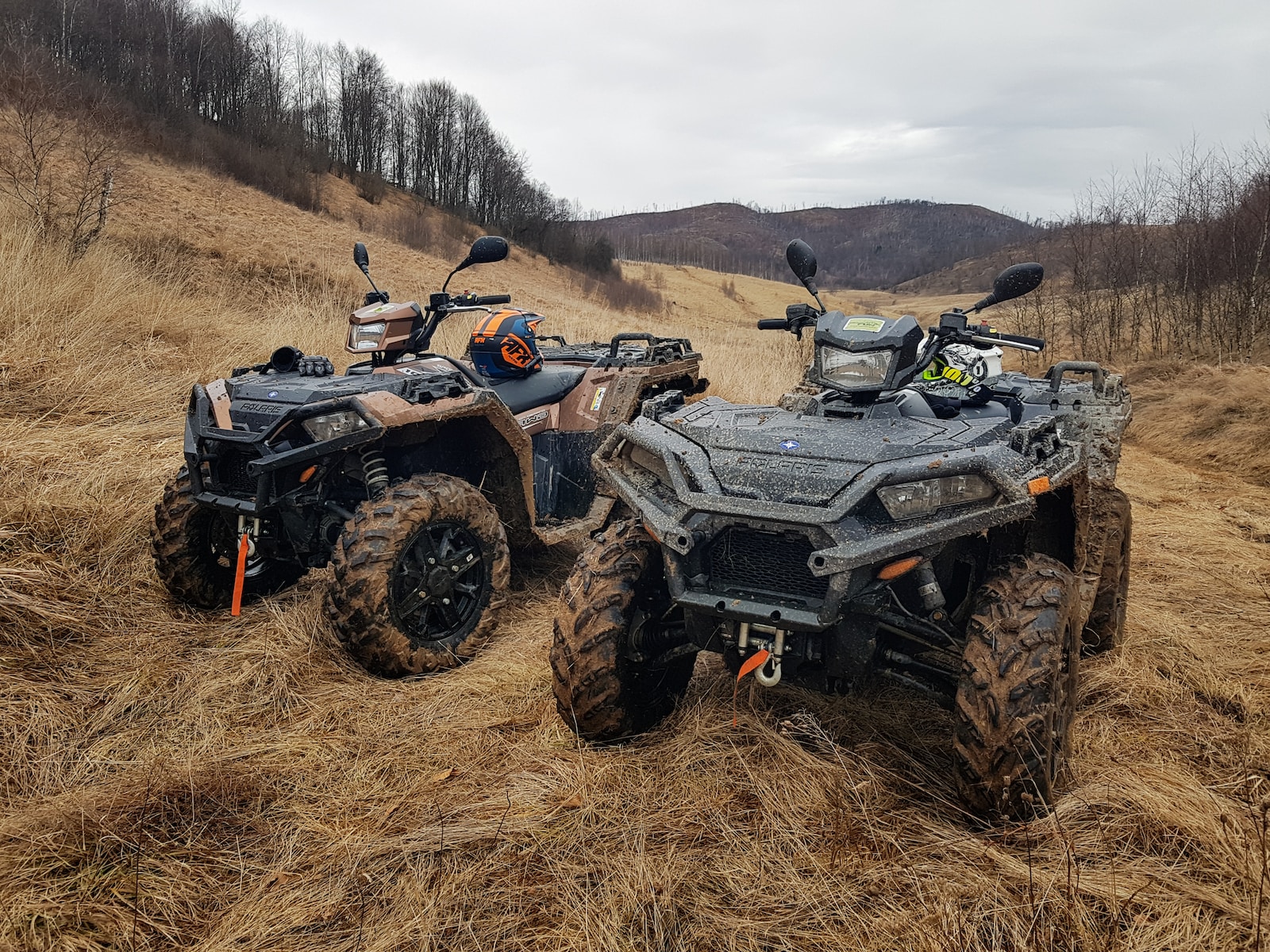 black and gray atv on brown field during daytime